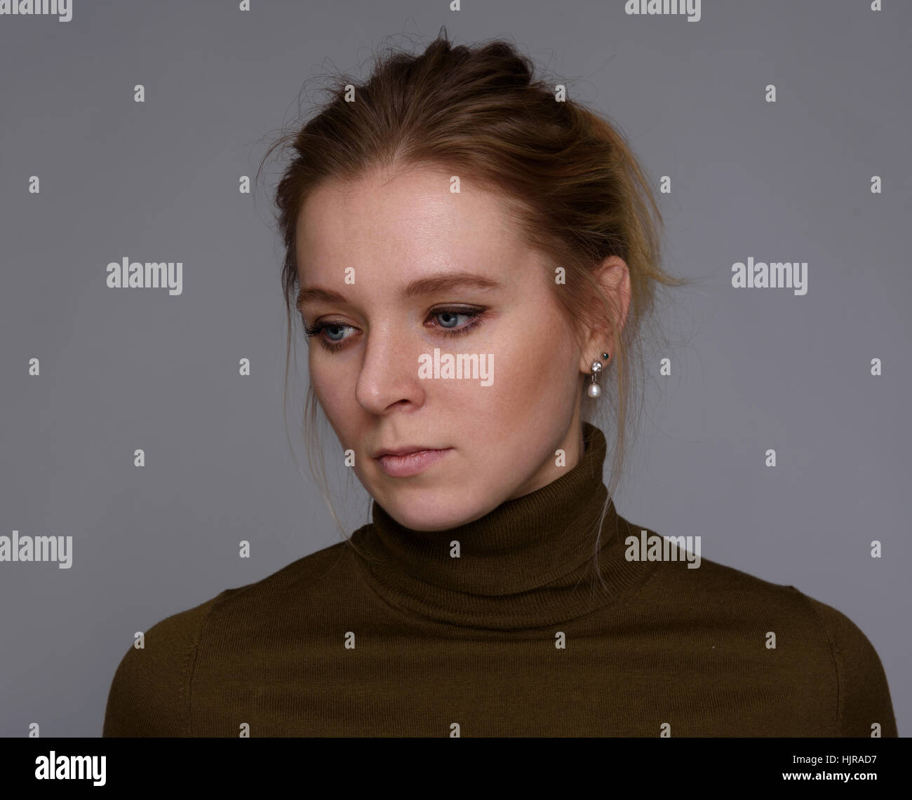 close up of sad woman portrait over gray background Stock Photo - Alamy