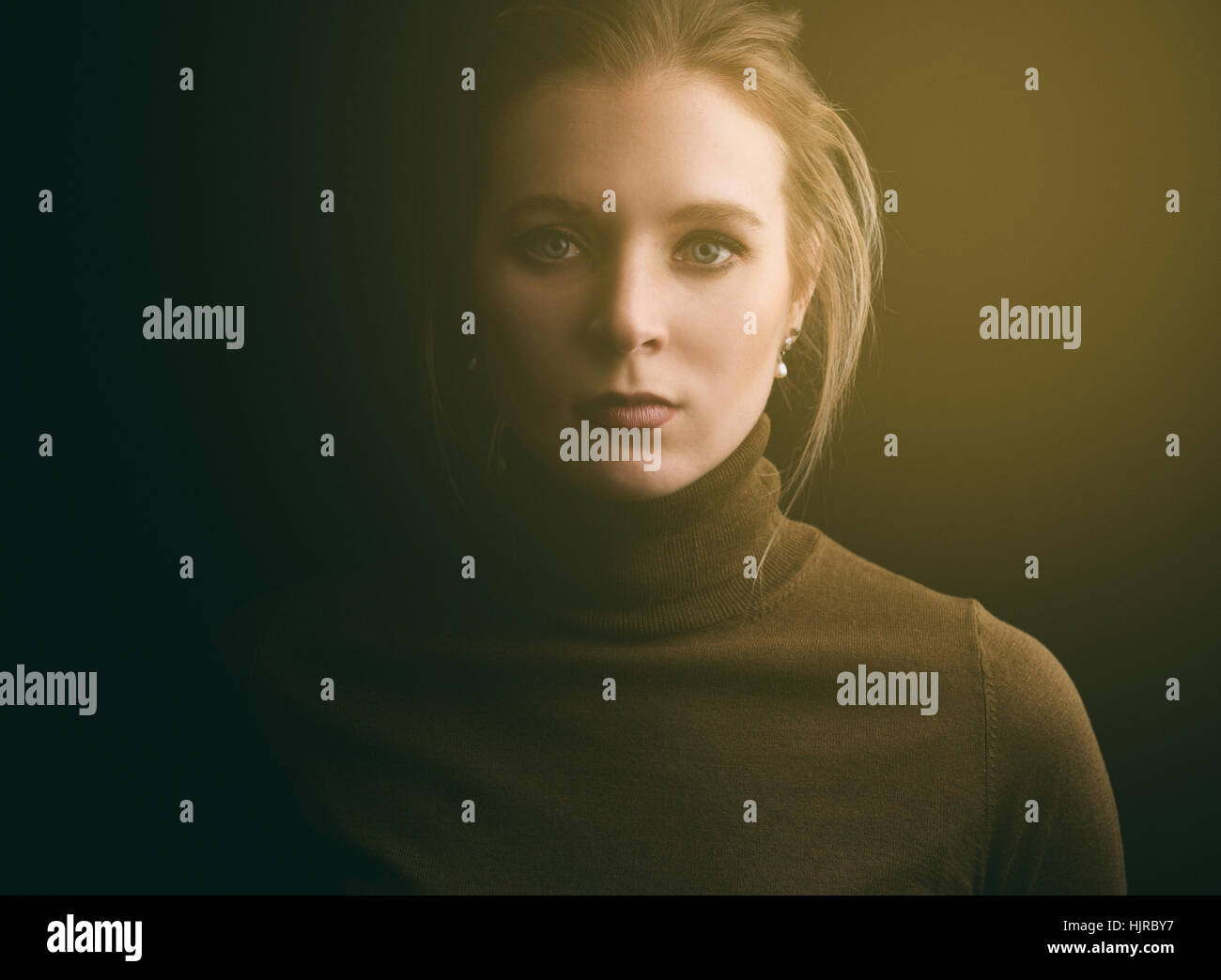 close up portrait of beautiful young woman. Dark background Stock Photo ...