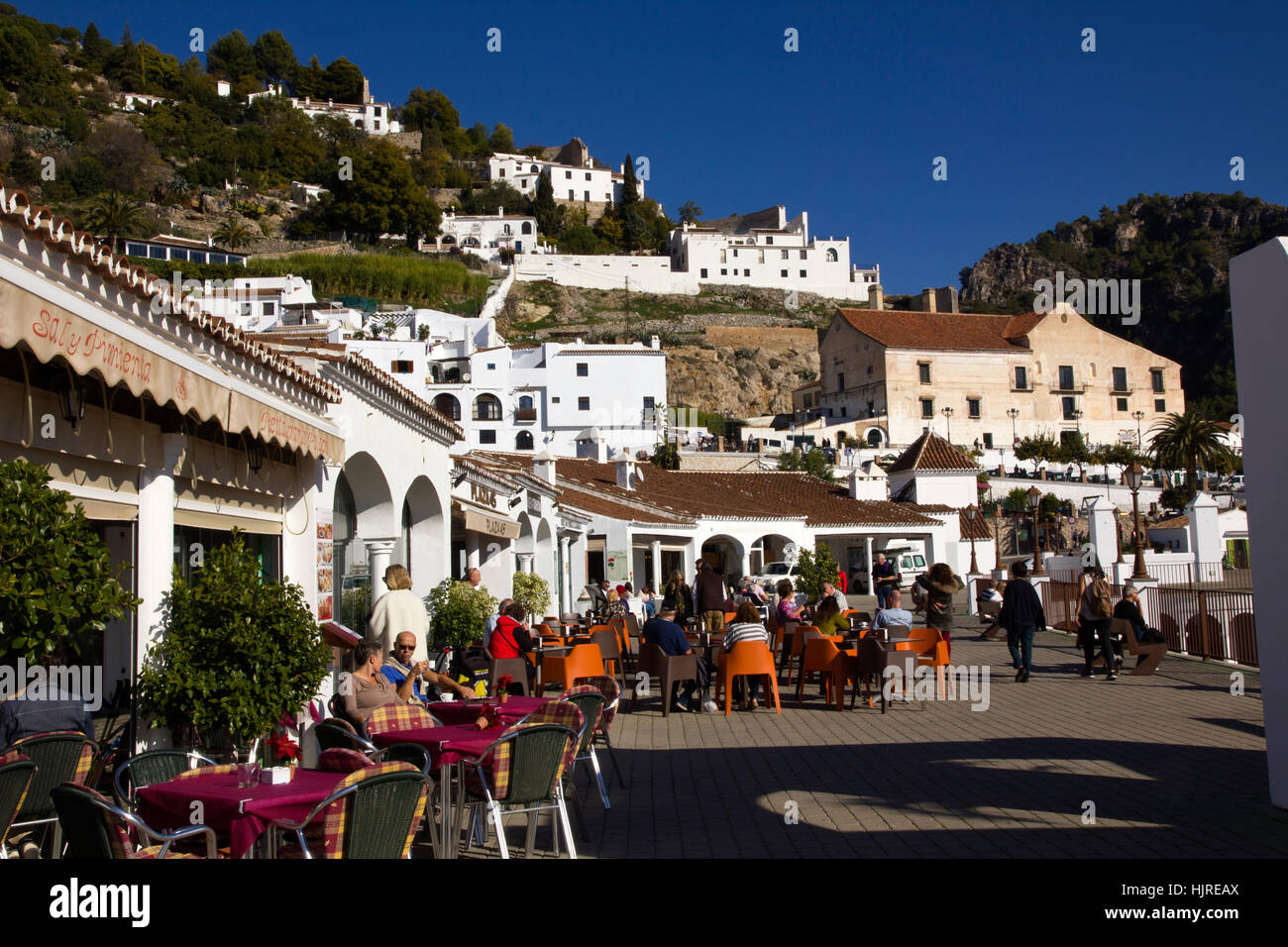 Cafe  with people enjoying the December sunshine in Spain. Stock Photo