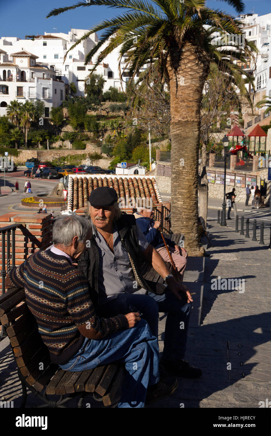 Local citizens sitting having a chat at Frigiliana, Spain Stock Photo