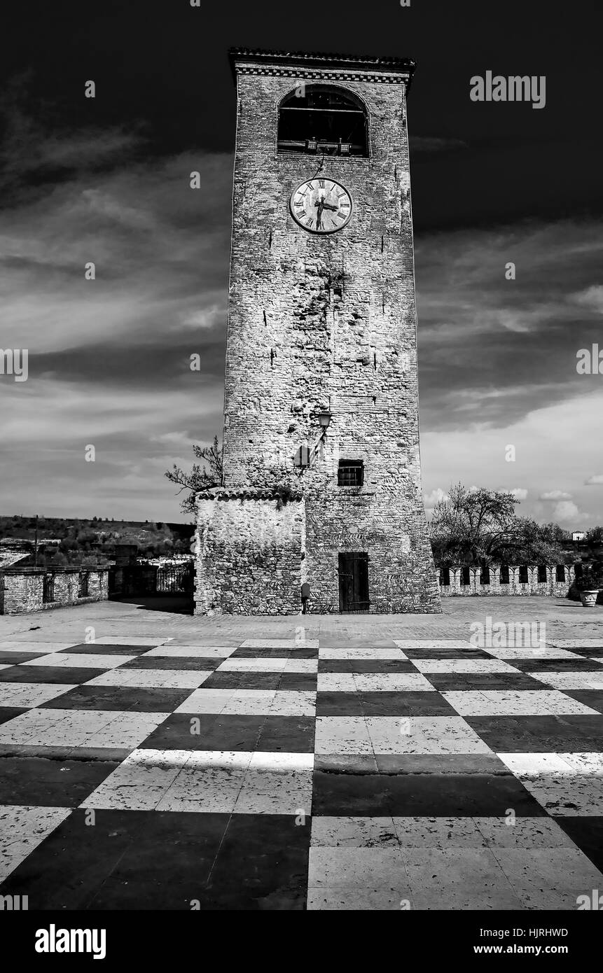 Castelvetro Modena clock tower checkerboard floor black and white Stock Photo