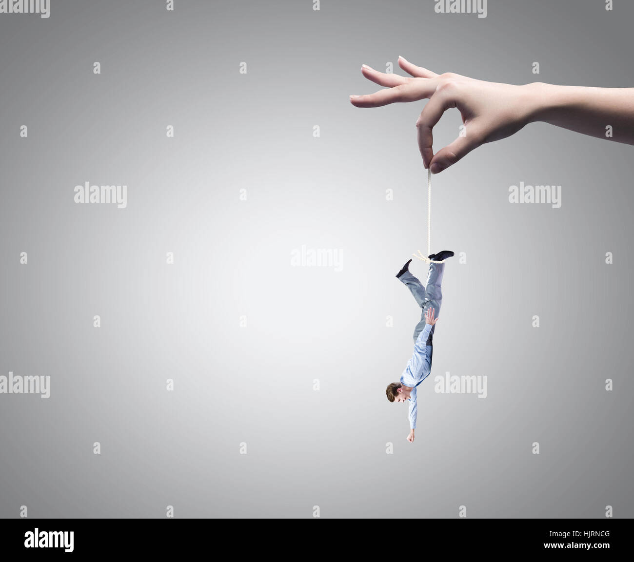Human Catching Close up of big human hand catching businessman Stock Photo - Alamy