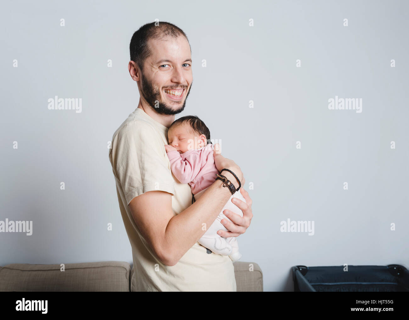 Happy father holding his newborn daughter Stock Photo - Alamy