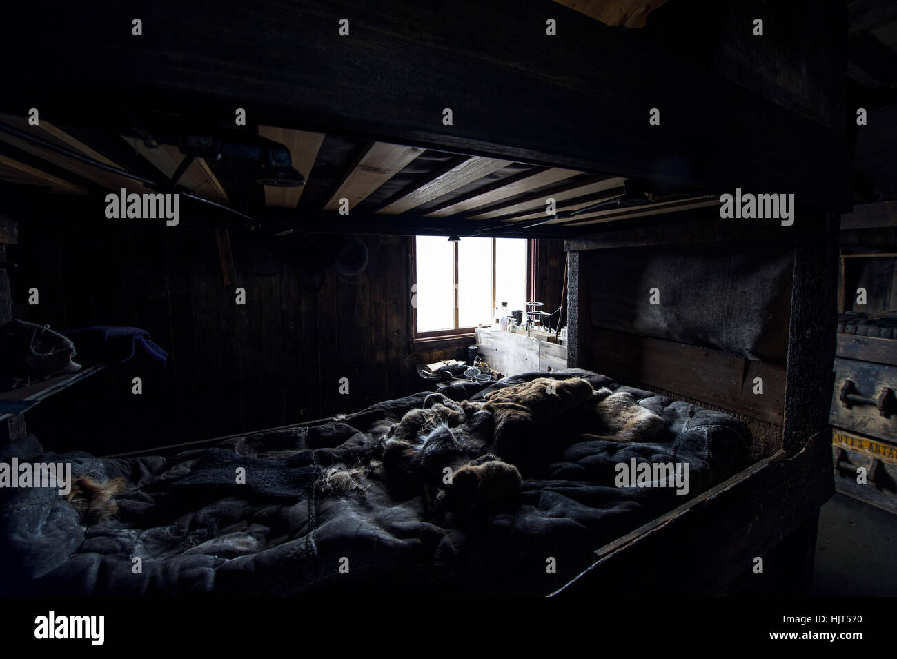 The private sleeping quarters and fur bed covers in the hut of Antarctic explorer Robert Falcon Scott. Stock Photo