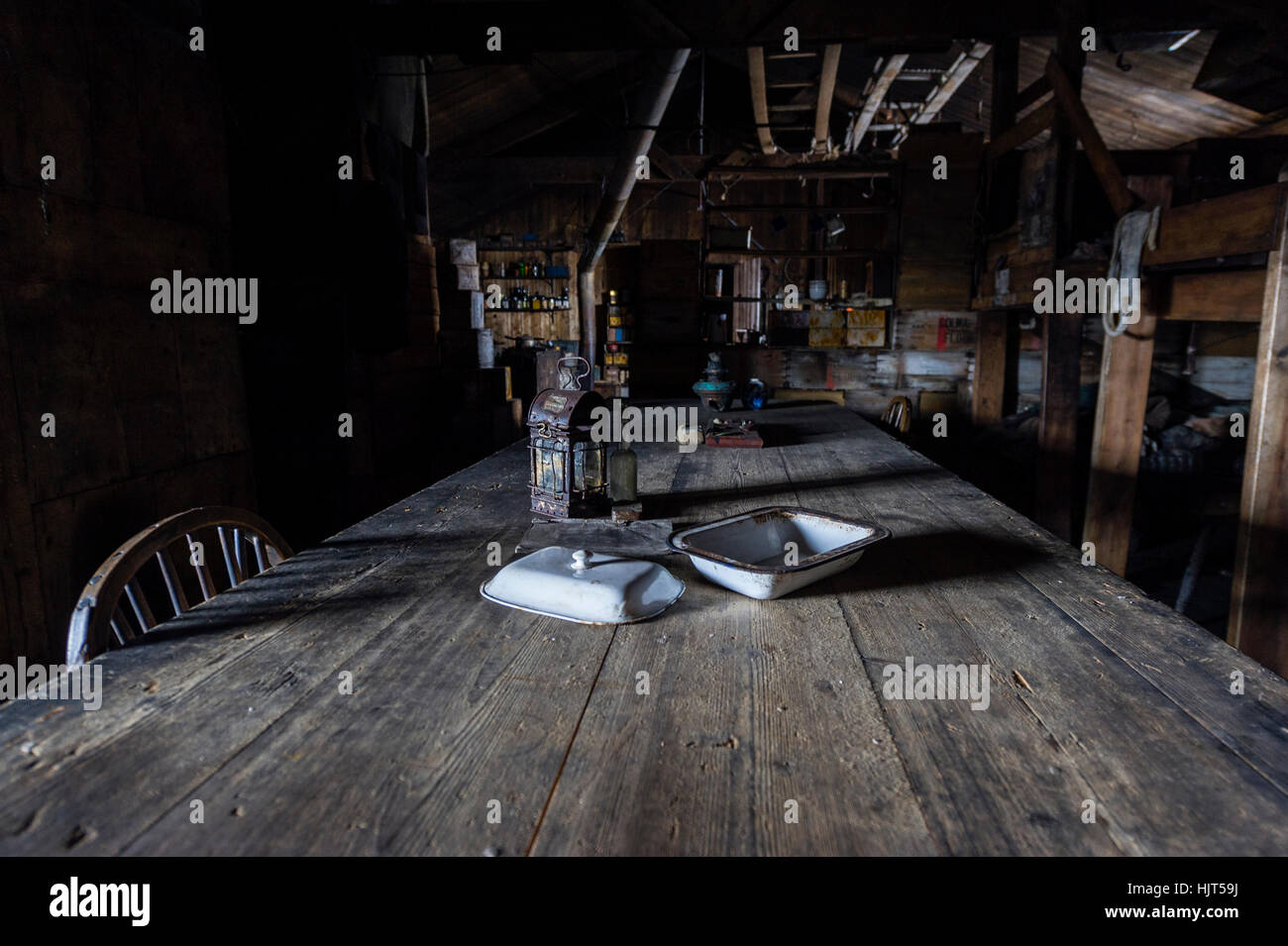 The famous weathered wardroom table in the hut of Antarctic explorer Robert Falcon Scott. Stock Photo