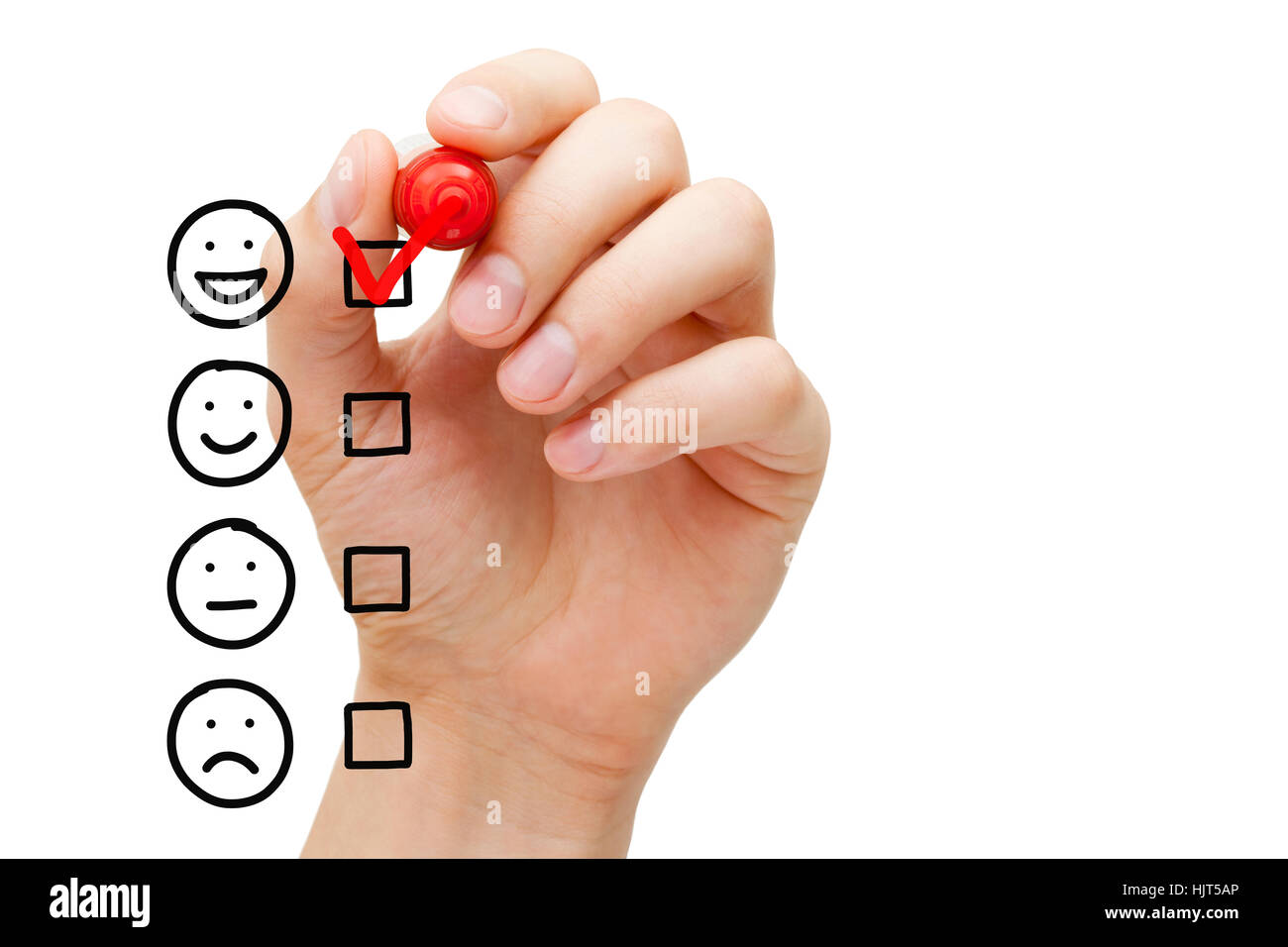 Hand putting red check mark on blank awesome survey checklist next to drawn happy face. Stock Photo