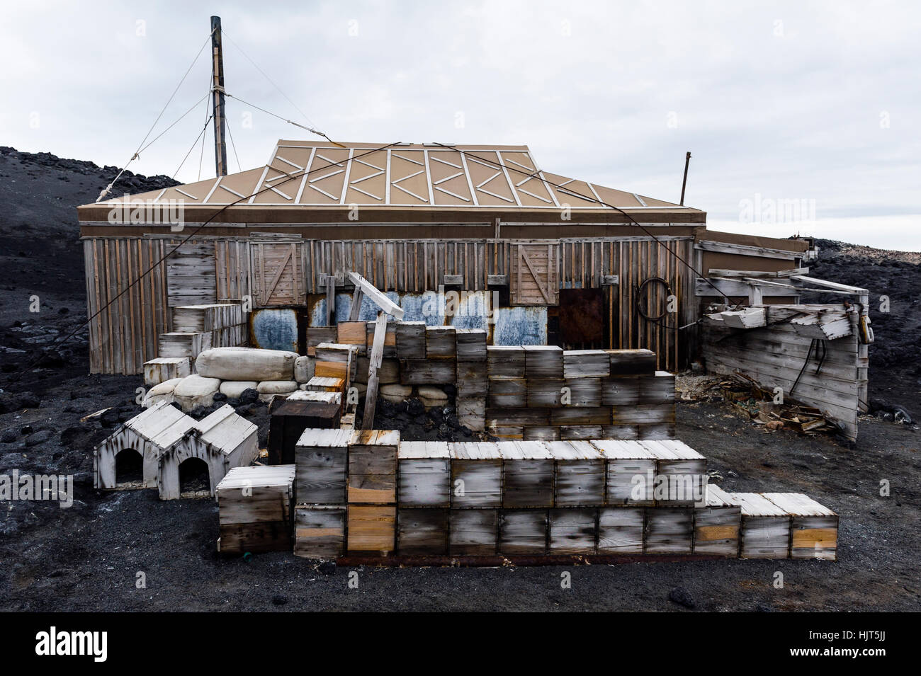 Food supply, storage boxes and dog kennels outside the hut of Antarctic explorer Ernest Shackleton. Stock Photo