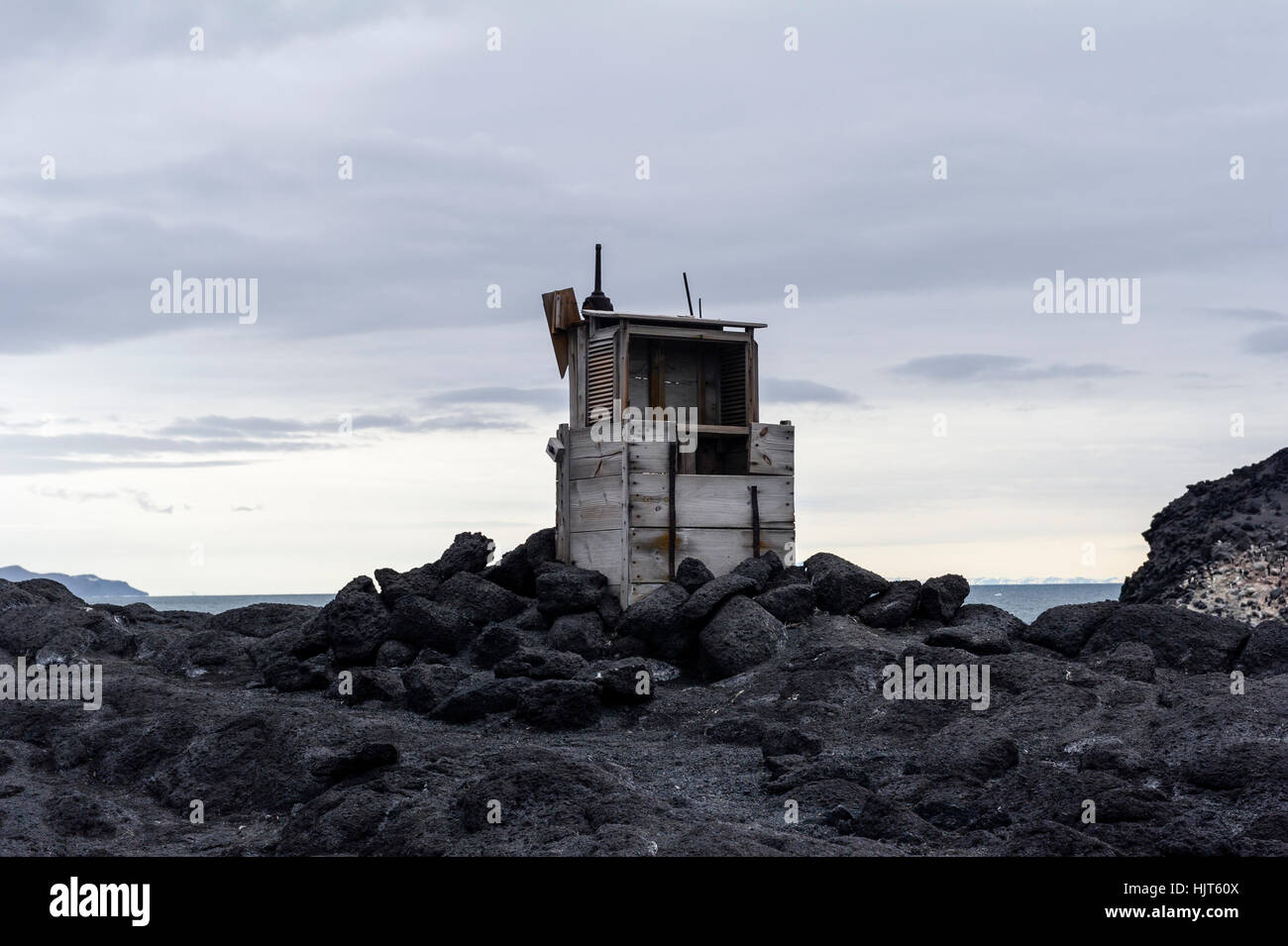 A weather station on an exposed rocky outcrop near Antarctic explorer Ernest Shackletons Hut. Stock Photo