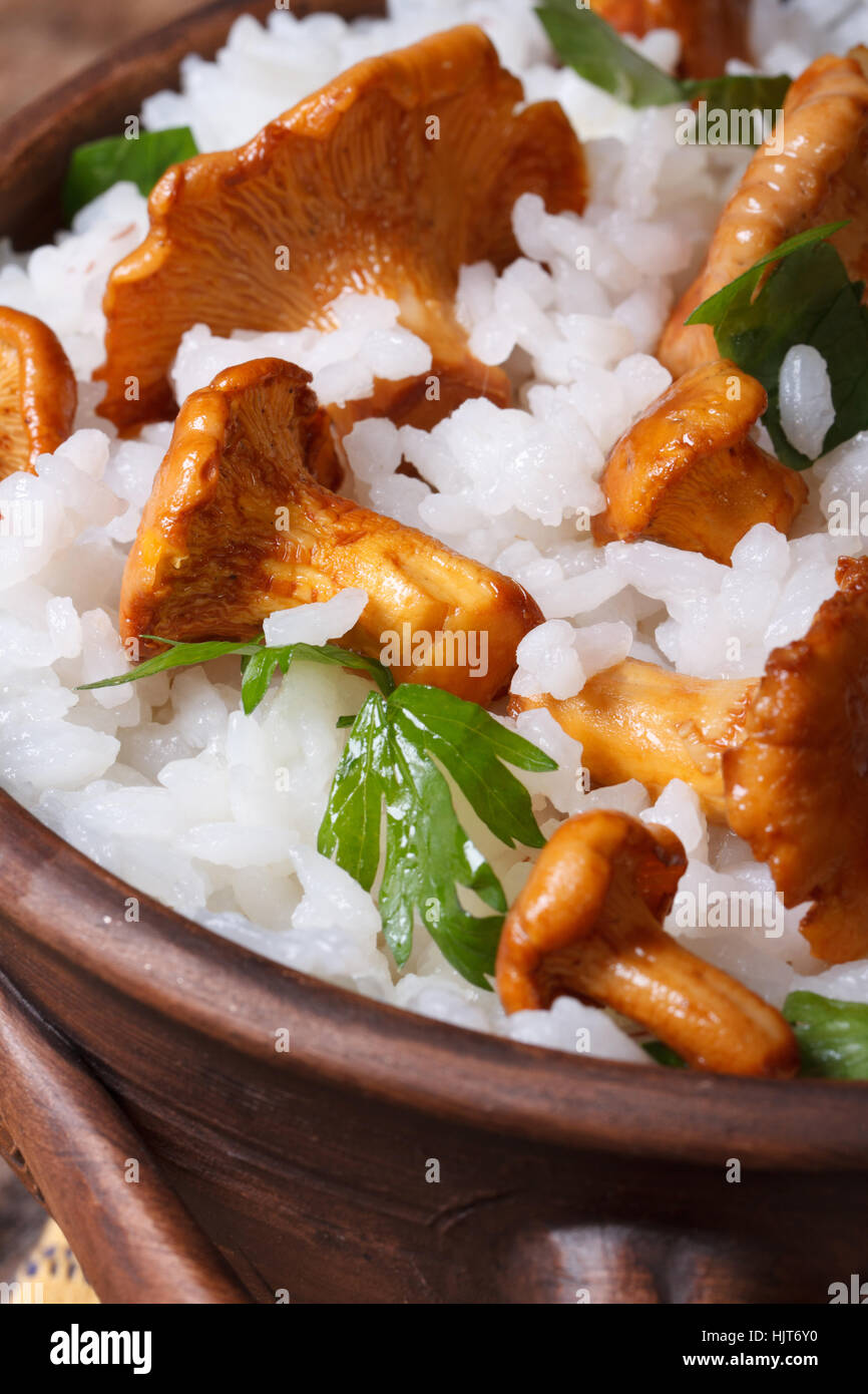 Risotto with chanterelle mushrooms in a bowl close up vertical Stock Photo