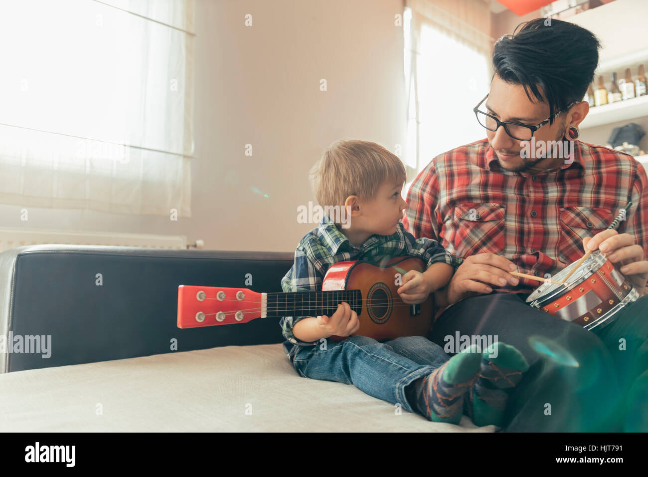 Father and son playing toy musical instruments Stock Photo - Alamy