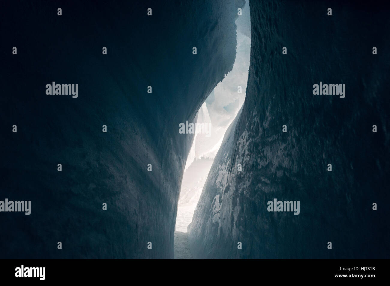 The frozen ceiling and icy walls of an ice cave in the Erebus Glacier Tongue. Stock Photo