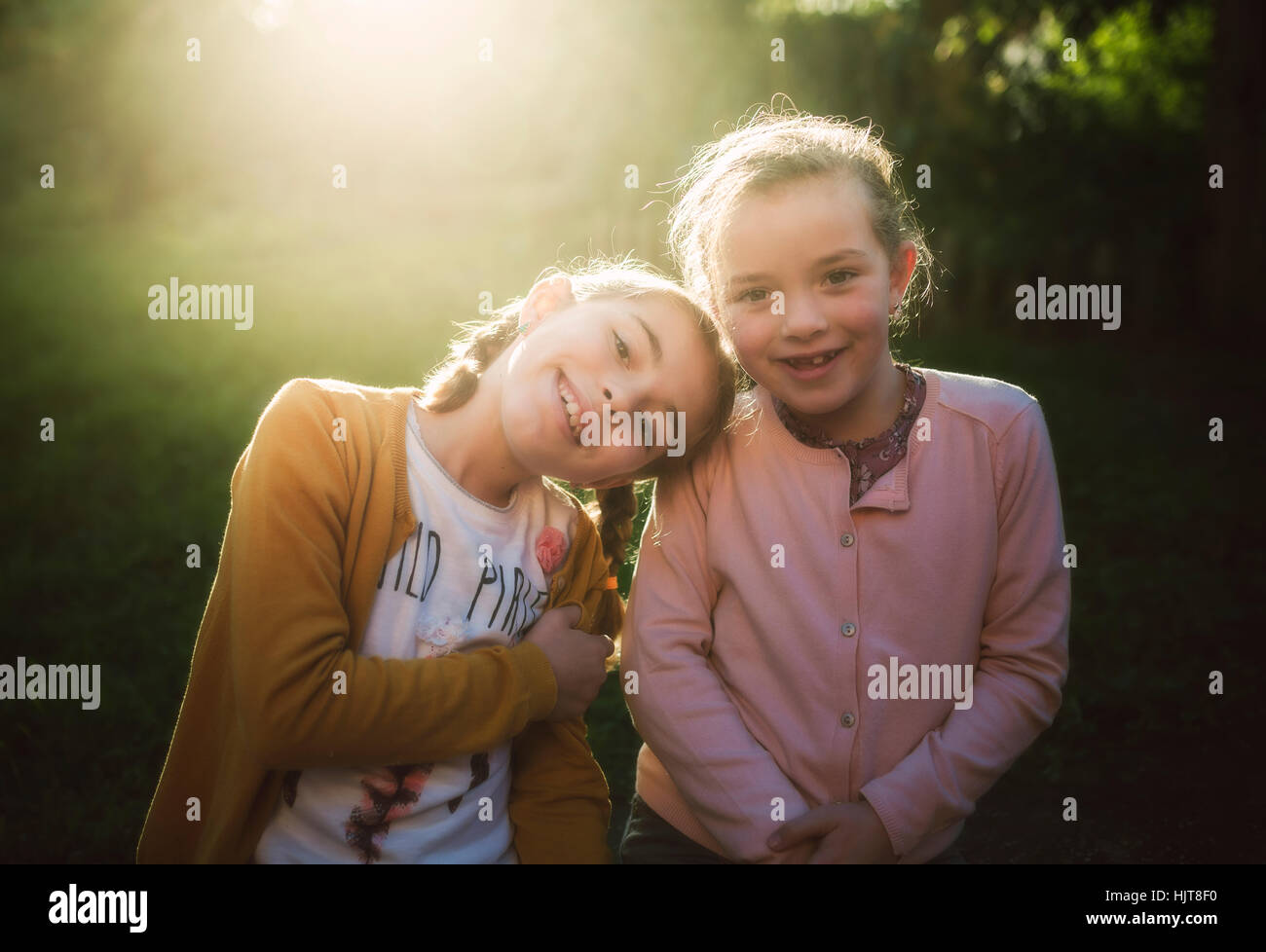 Portrait of two little girls at backlight Stock Photo