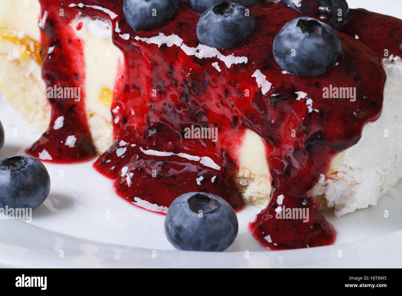 Blueberry cheesecake with berry sauce on a plate macro horizontal Stock Photo