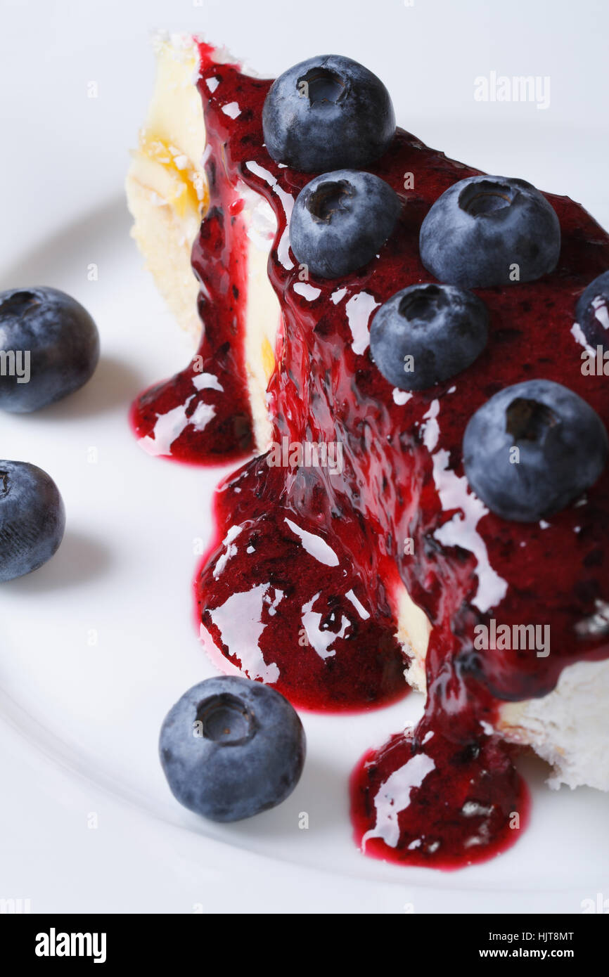 blueberry cheesecake drizzled with berry sauce. macro vertical Stock Photo