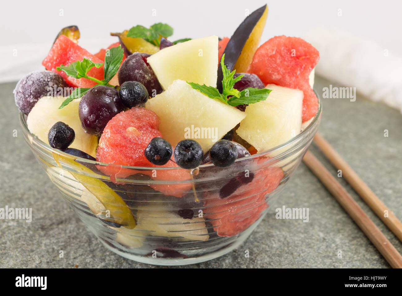 fruit salad served in a glass bowl with heartshaped watermellon slices Stock Photo