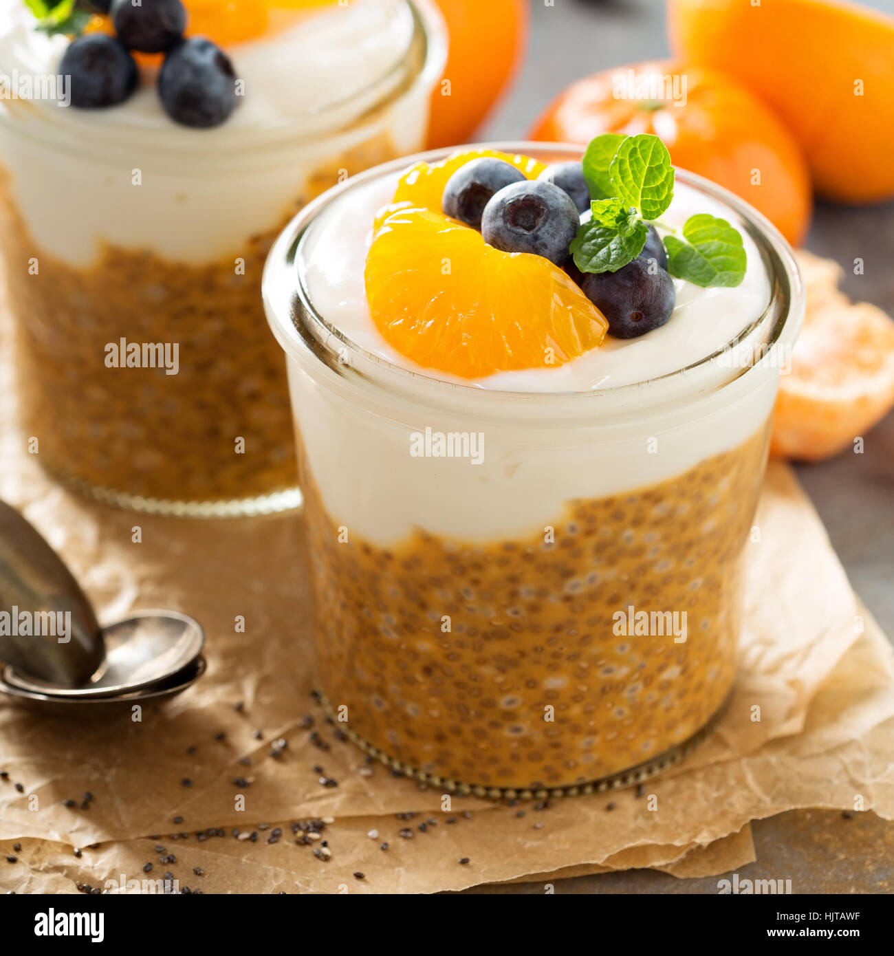 Orange chia pudding with coconut yogurt Stock Photo