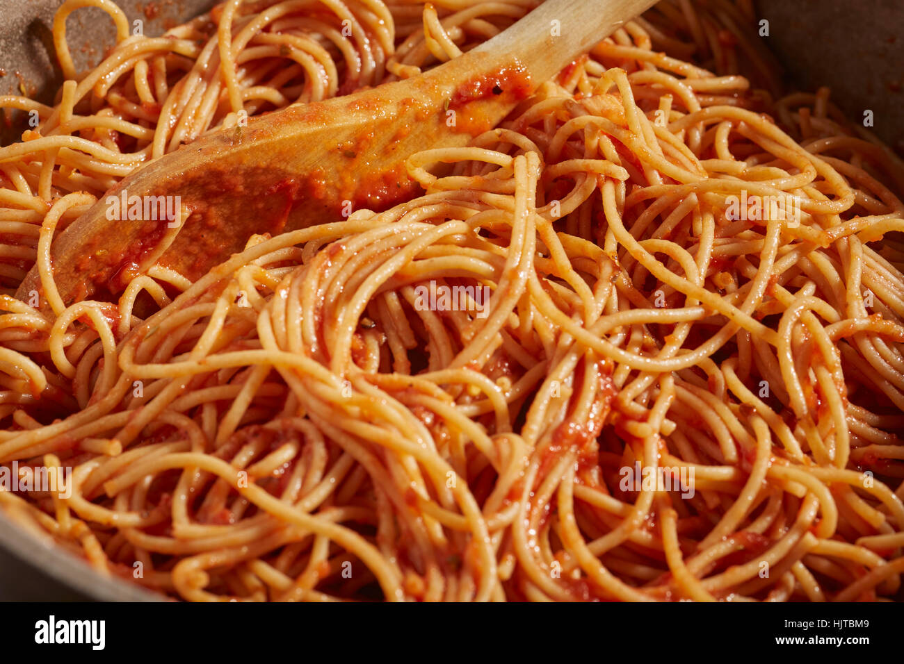 a pot of whole wheat spaghetti with vegetarian tomato sauce Stock Photo