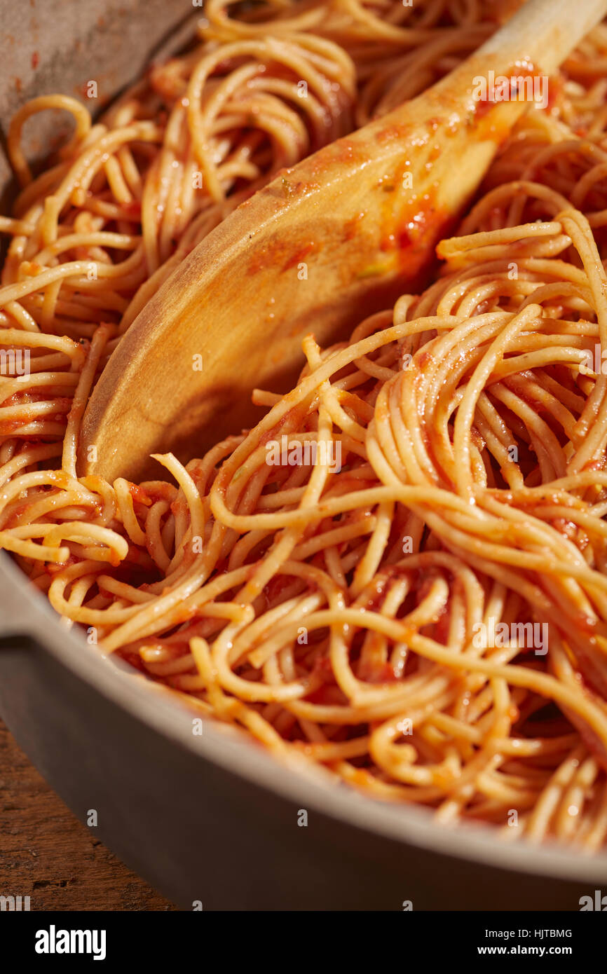 a pot of whole wheat spaghetti with vegetarian tomato sauce Stock Photo