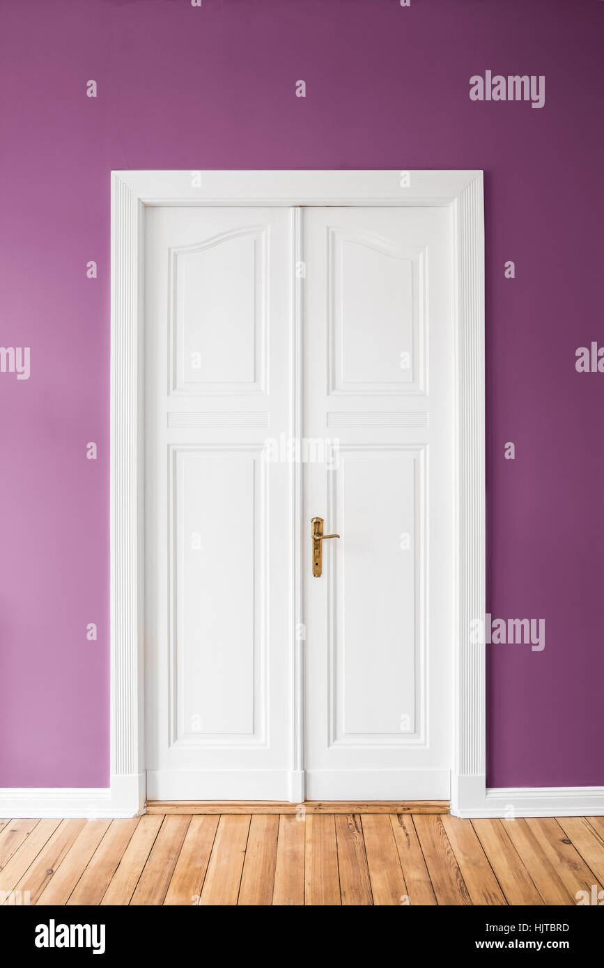 wing door on pink wall -  renovated apartment interior - Stock Photo