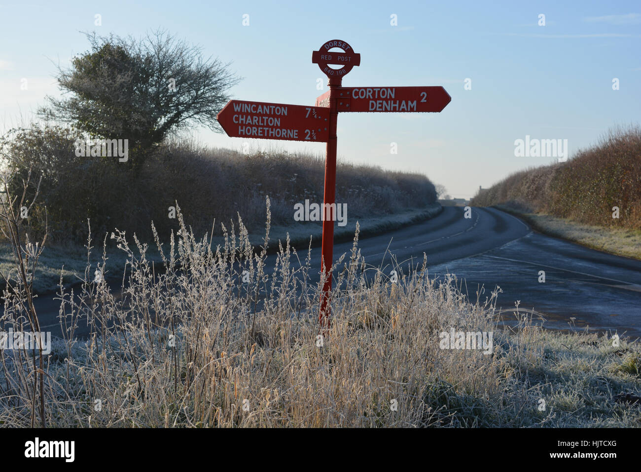 Dorset red signpost. Heavy frost and black ice on the road between Charlton Horethorne and