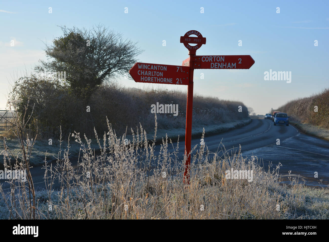 Dorset red signpost. Heavy frost and black ice on the road between Charlton Horethorne and
