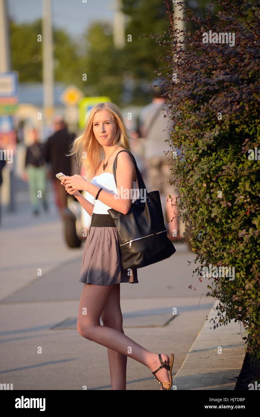 Blonde girl standing on the streets of Budapest, Hungary Stock Photo