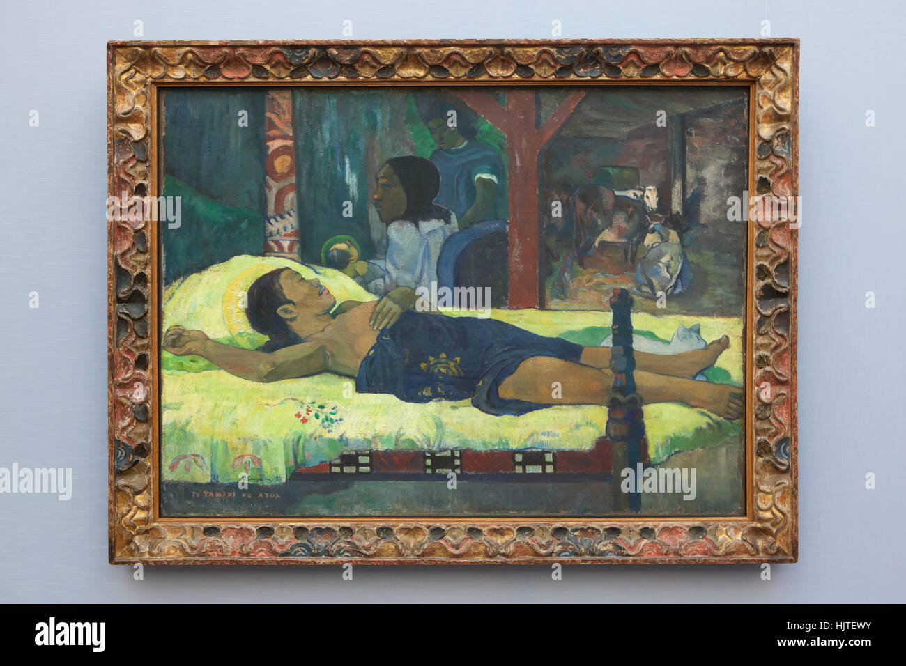 Painting Te tamari no atua (The Birth, 1896) by French post-impressionist painter Paul Gauguin on display in the Neue Pinakothek (New Pinacotheca) in Munich, Bavaria, Germany. Stock Photo