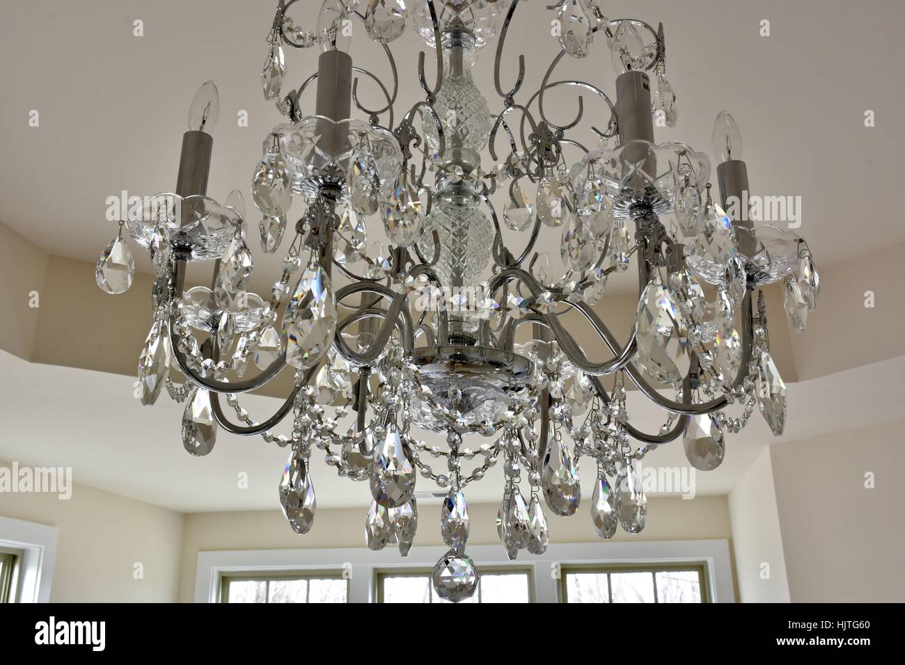 Crystal Chandelier Hanging From The Ceiling Of A Master