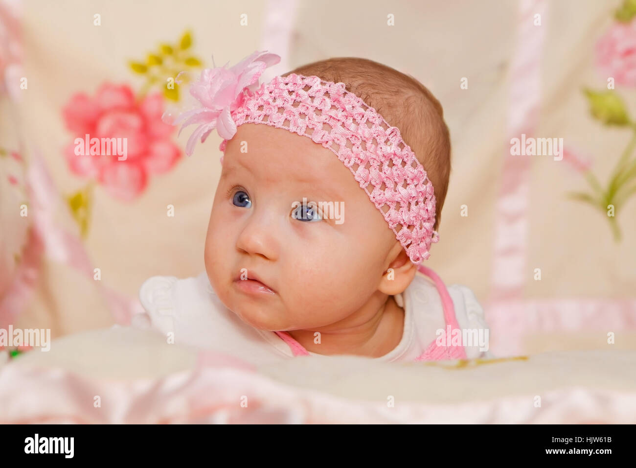 Cute Baby girl on flower blanket Stock Photo Alamy