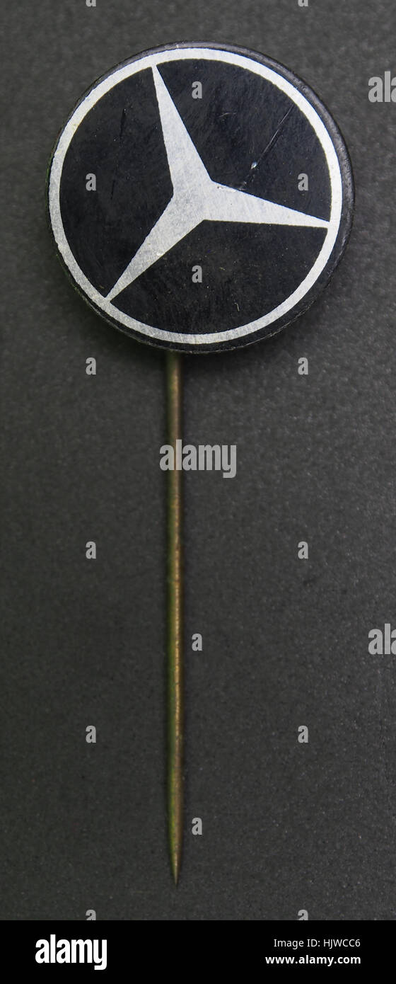 A vintage Mercedes advertising pin, representing the iconic German ...