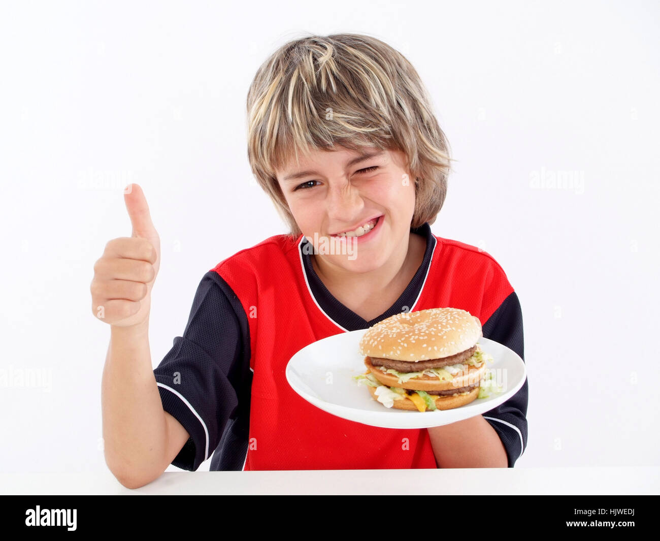 Boy likes burger Stock Photo