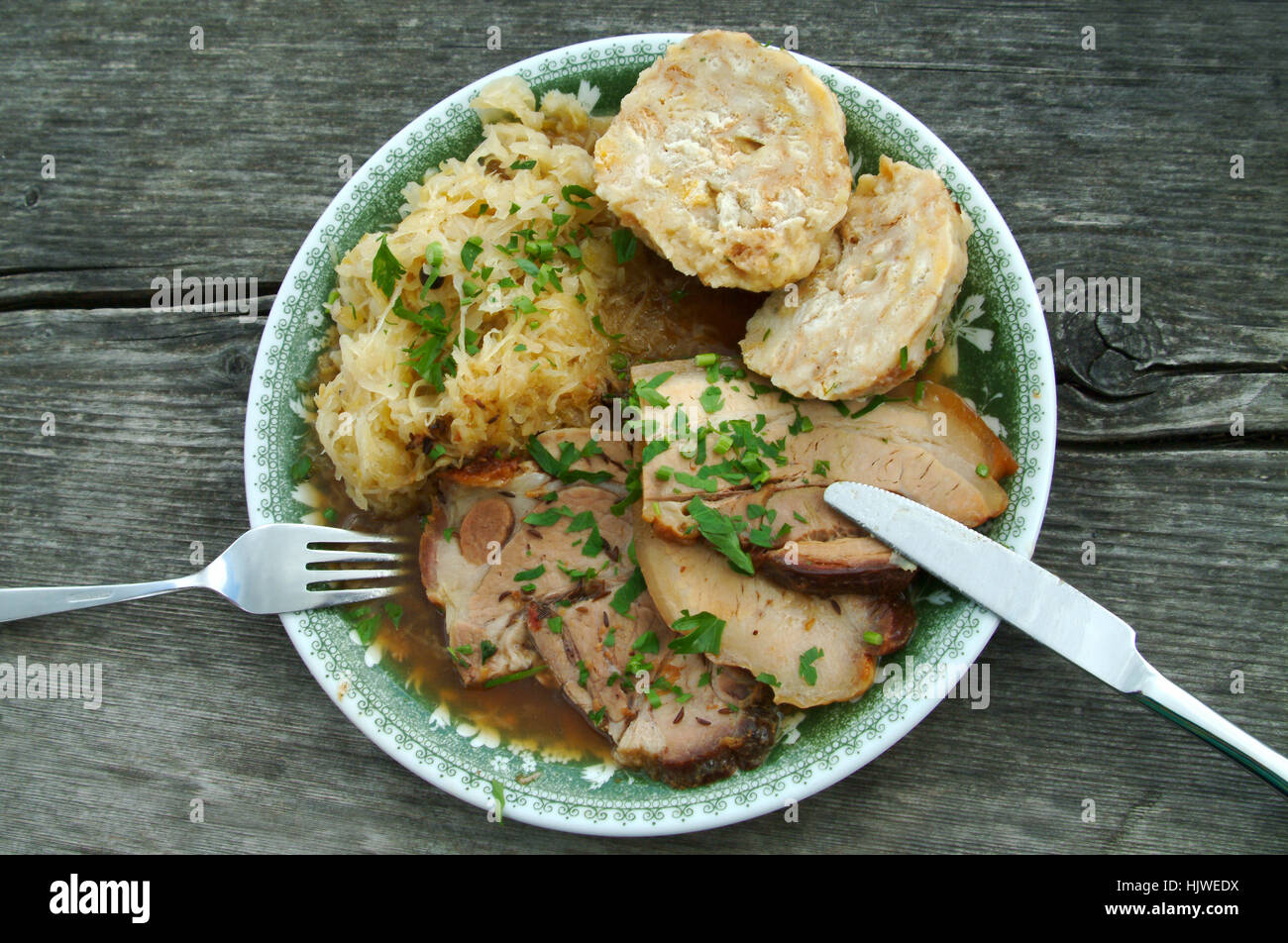 Austrian plain fare, roast pork with bread dumpling and sauerkraut Stock Photo