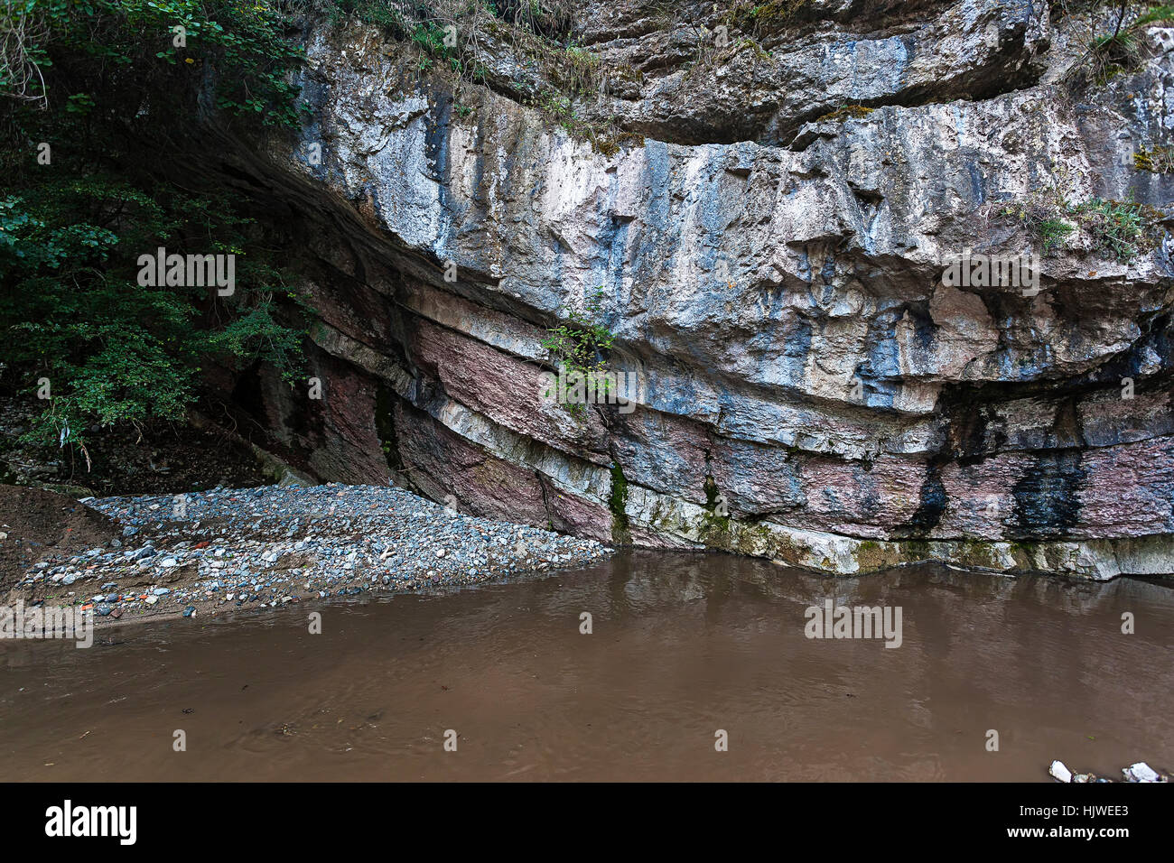 Multi-colored layered rock solid minerals Stock Photo