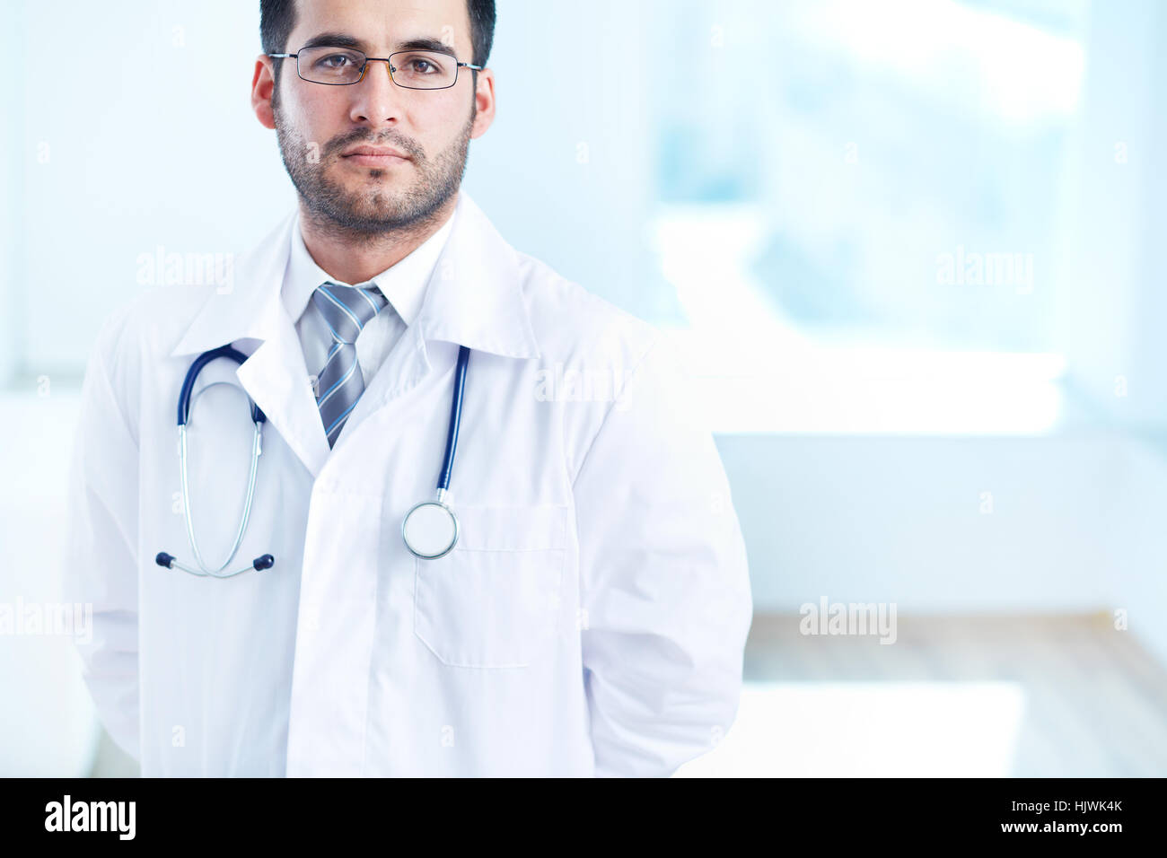Young unshaven male doctor hi-res stock photography and images - Alamy