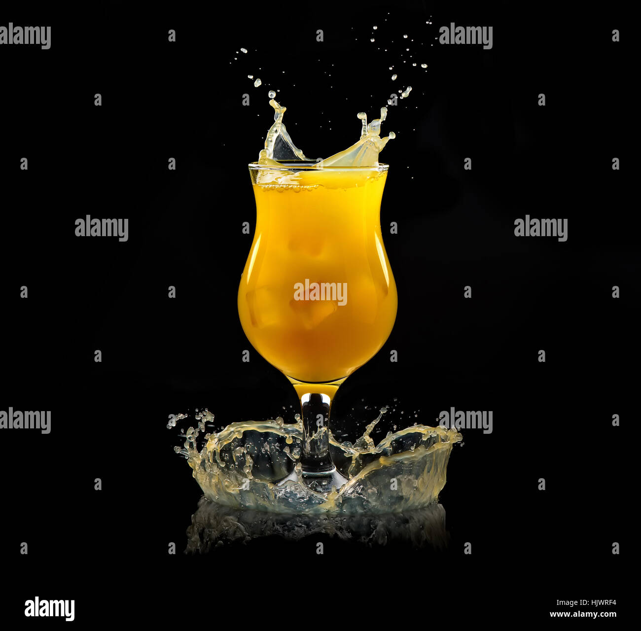 Orange juice splash on black hi-res stock photography and images - Alamy