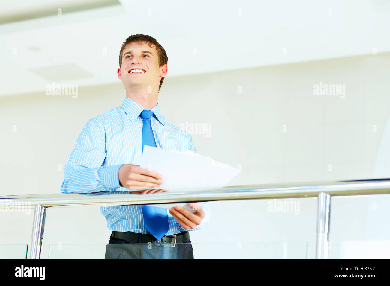Portrait of happy smiling young businessman hi-res stock photography ...