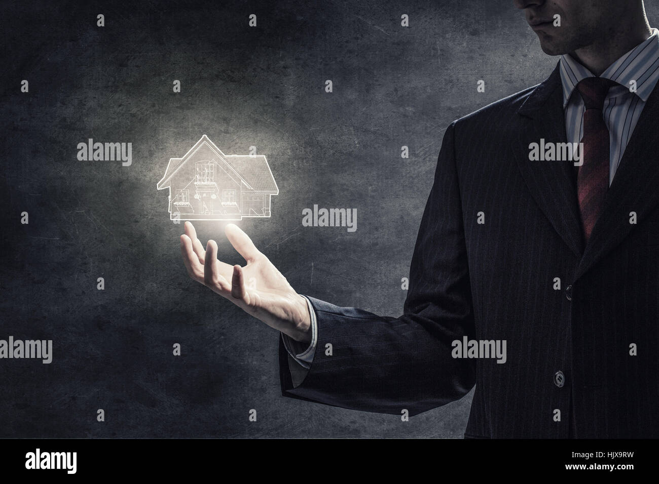 Close up of hand holding house model in palm Stock Photo - Alamy