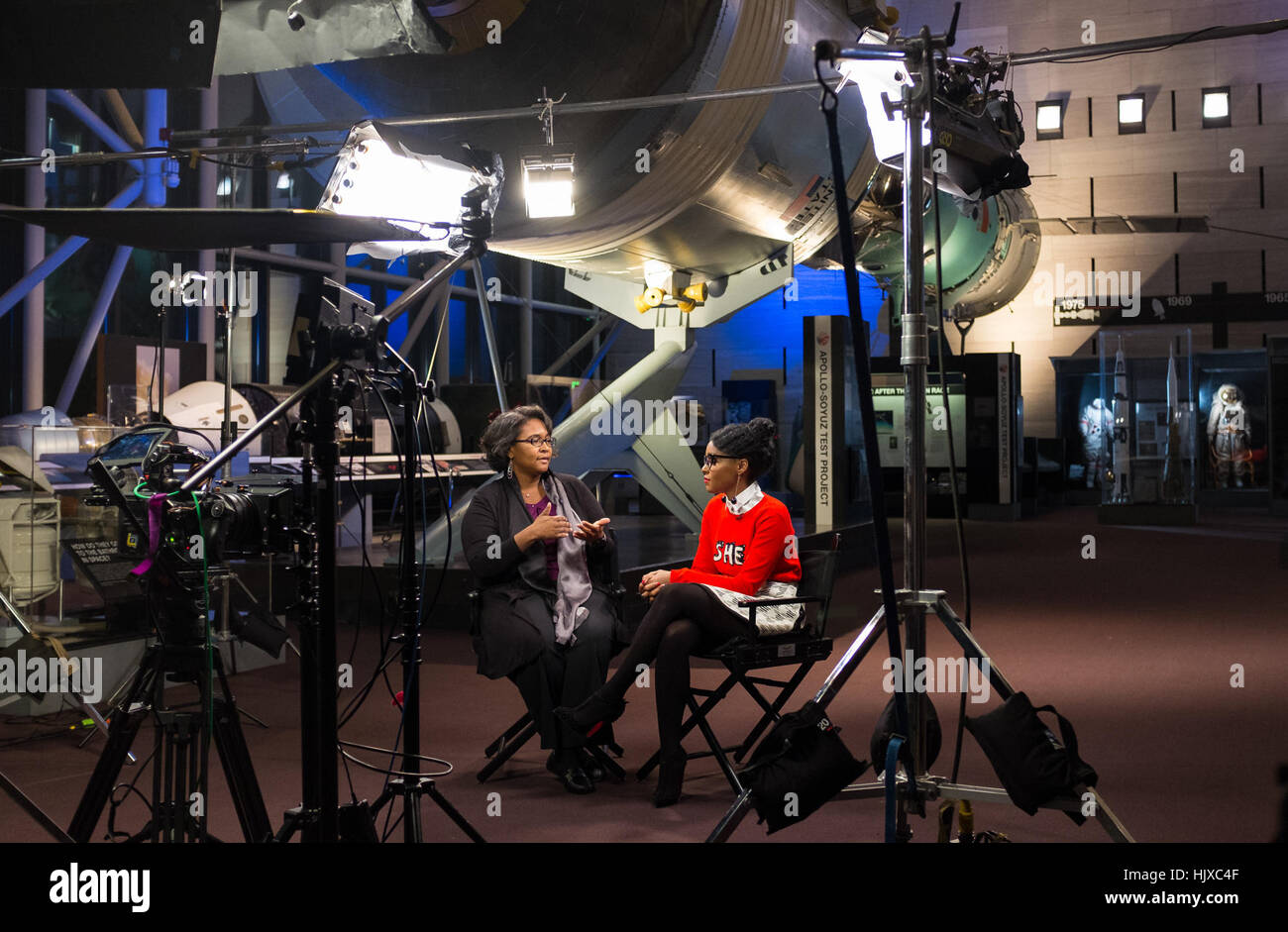 Program Executive for Game Changing Development in NASA’s Space Technology Mission Directorate LaNetra Tate, left, speaks with American musical recording artist, actress, and model Janelle Monáe, right, about the movie “Hidden Figures” during taping of media interviews, Tuesday, Dec. 13, 2016, at the Smithsonian’s National Air and Space Museum in Washington, DC. The film is based on the book of the same title, by Margot Lee Shetterly, and chronicles the lives of Katherine Johnson, Dorothy Vaughan and Mary Jackson -- African-American women working at NASA as “human computers,” who were critical Stock Photo
