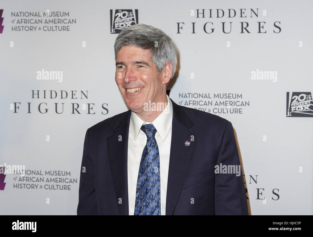 NASA Chief Historian Bill Barry arrives on the red carpet for a screening of the film “Hidden Figures” at the Smithsonian’s National Museum of African American History and Culture, Wednesday, Dec. 14, 2016 in Washington DC. The film is based on the book of the same title, by Margot Lee Shetterly, and chronicles the lives of Katherine Johnson, Dorothy Vaughan and Mary Jackson -- African-American women working at NASA as “human computers,” who were critical to the success of John Glenn’s Friendship 7 mission in 1962. Stock Photo