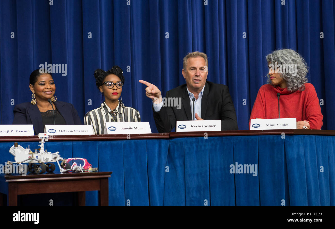 American actor, film director, and producer, Kevin Costner, second from right, speaks on a panel with fellow cast members, Octavia Spencer, left, and Janelle Monae, second left, and producer Mimi Valdés, right, after a screening of the film “Hidden Figures” at the White House, Thursday, Dec. 15, 2016 in Washington. The film is based on the book of the same title, by Margot Lee Shetterly, and chronicles the lives of Katherine Johnson, Dorothy Vaughan and Mary Jackson -- African-American women working at NASA as “human computers,” who were critical to the success of John Glenn’s Friendship 7 mis Stock Photo