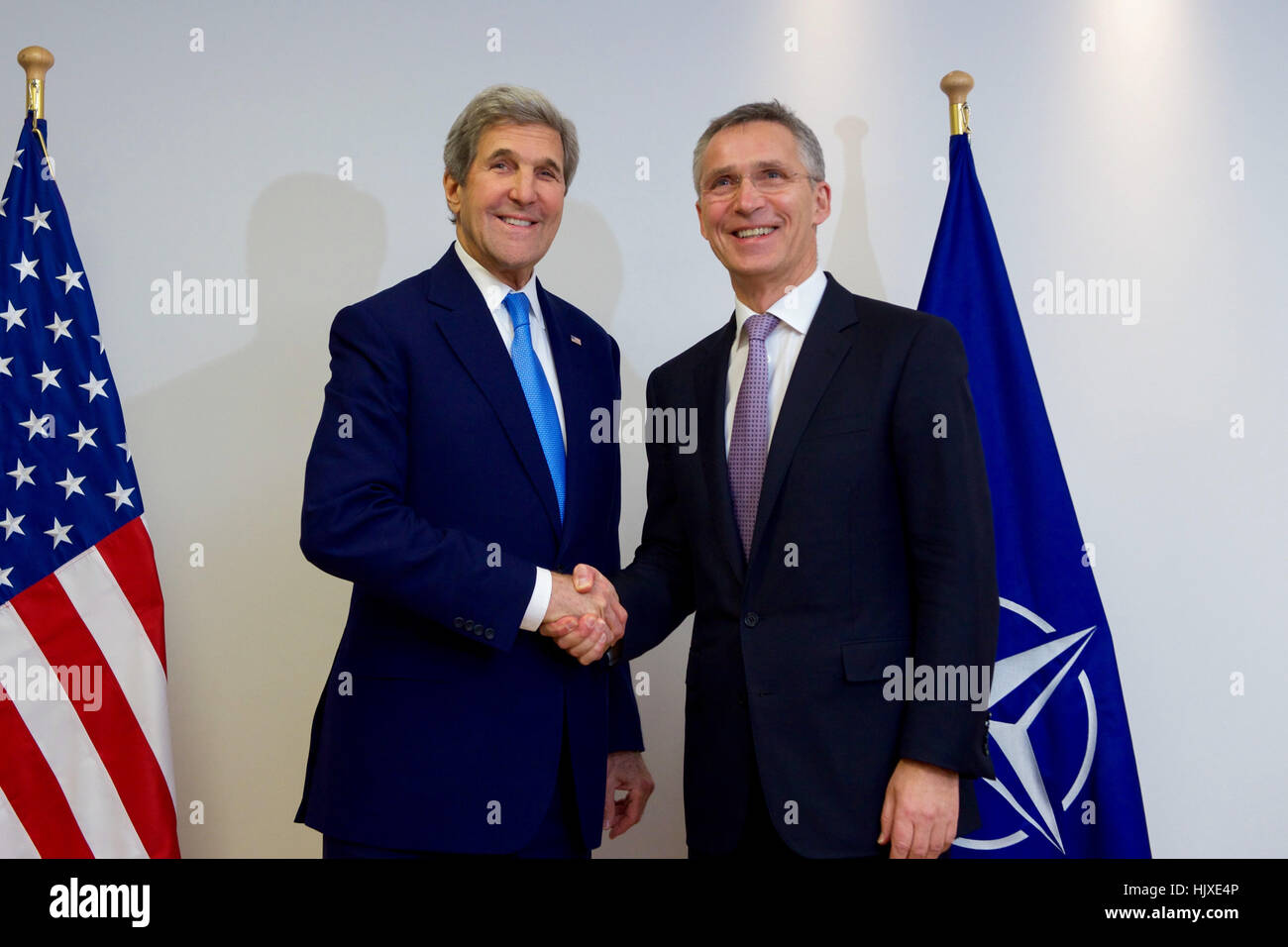 U.S. Secretary of State John Kerry shakes hands with North Atlantic Treaty Organization Secretary-General Jens Stoltenberg on December 6, 2016, before they hold a &quot;signals check&quot; preceding a NATO Ministerial Session at the alliance's headquarters in Brussels, Belgium. Stock Photo