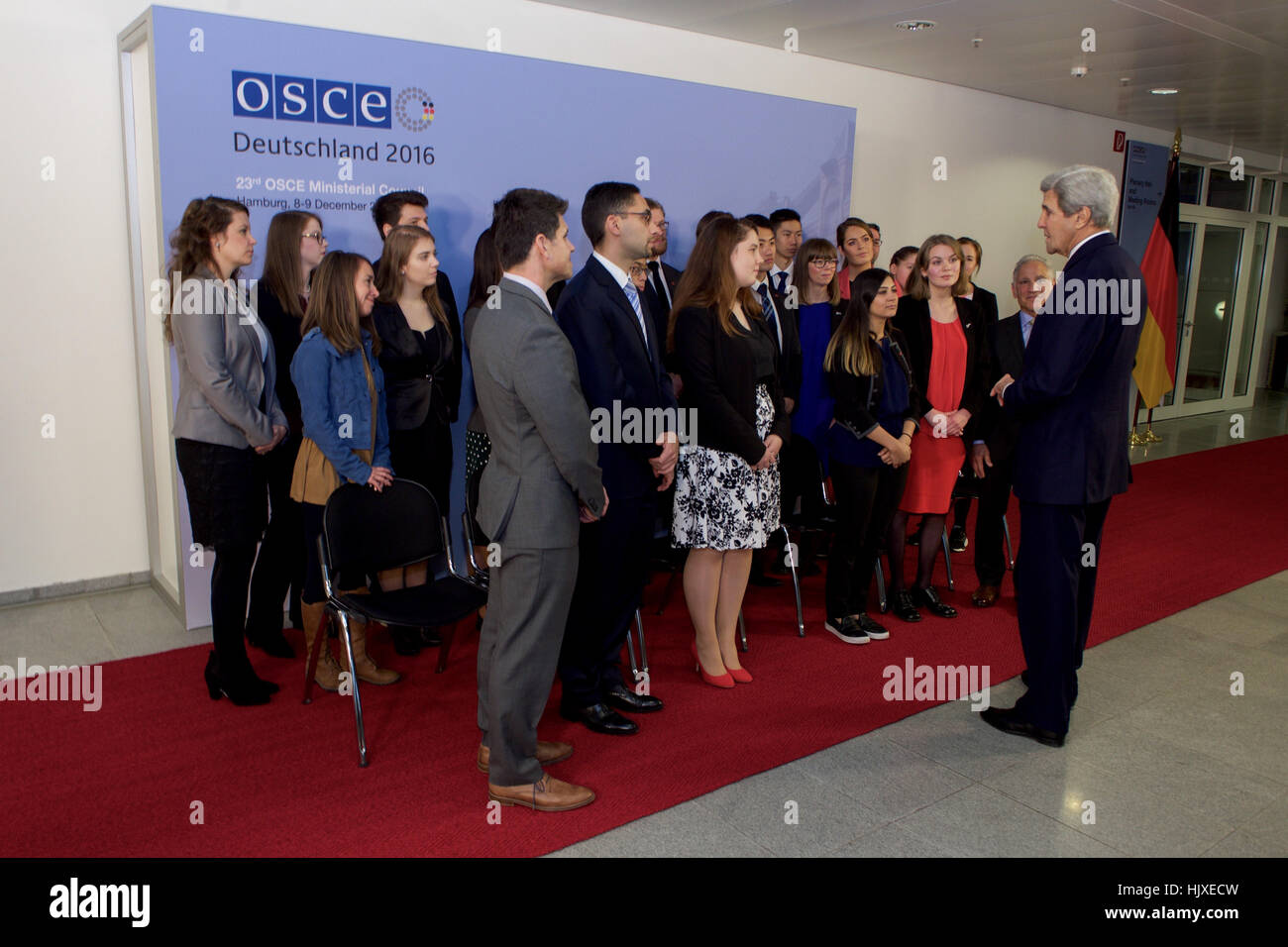 U.S. Secretary of State John Kerry speaks with a group of students who entered a peer competition about issues involving countering violent extremism as they attend a meeting of the Organization for Security and Co-operation in Europe hosted by German Foreign Minister Frank-Walter Steinmeier, and held at the Hamburg Messe in Hamburg, Germany, on December 8, 2016. Stock Photo