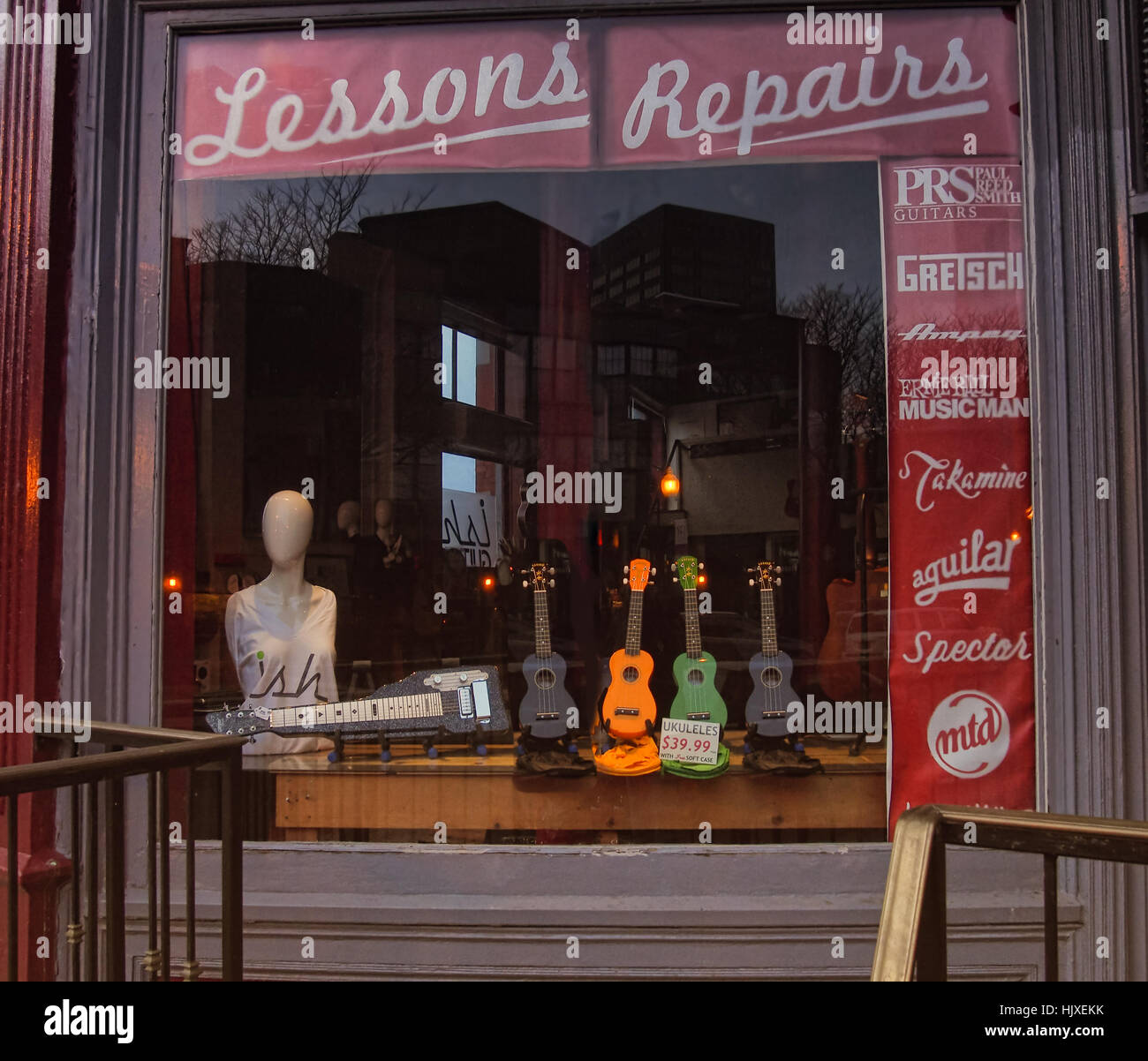 Syracuse, New York, USA. January 23, 2017. Music store window in Armory Square, Syracuse, New York, shot from public street Stock Photo