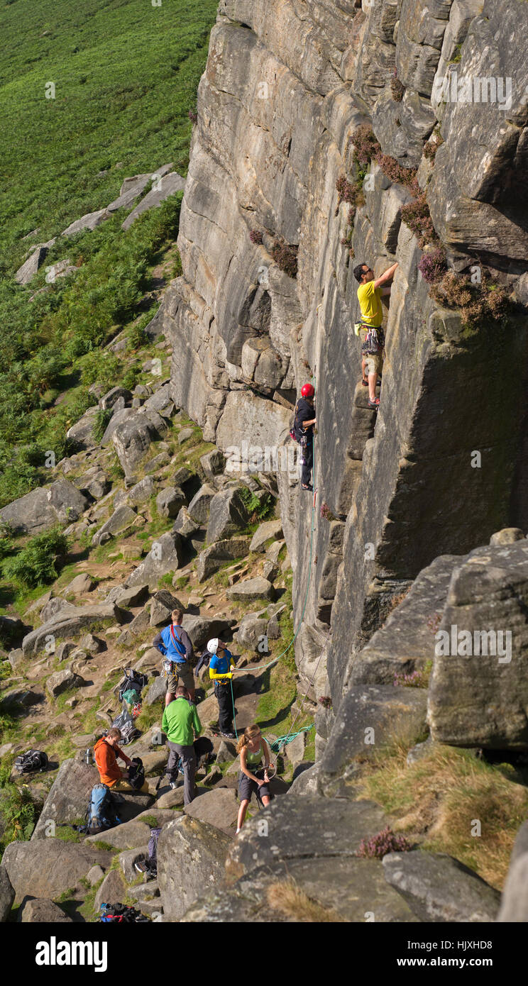 Rock climbers on Stanage Edge, Peak District National Park, UK Stock