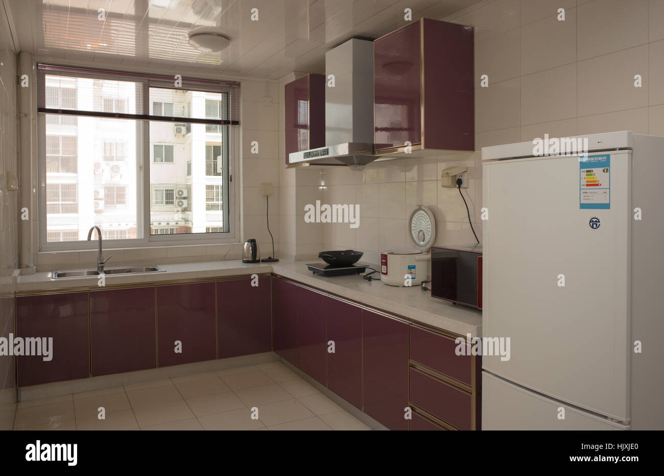 Kitchen interior with common appliances in apartment, Nanjing, China
