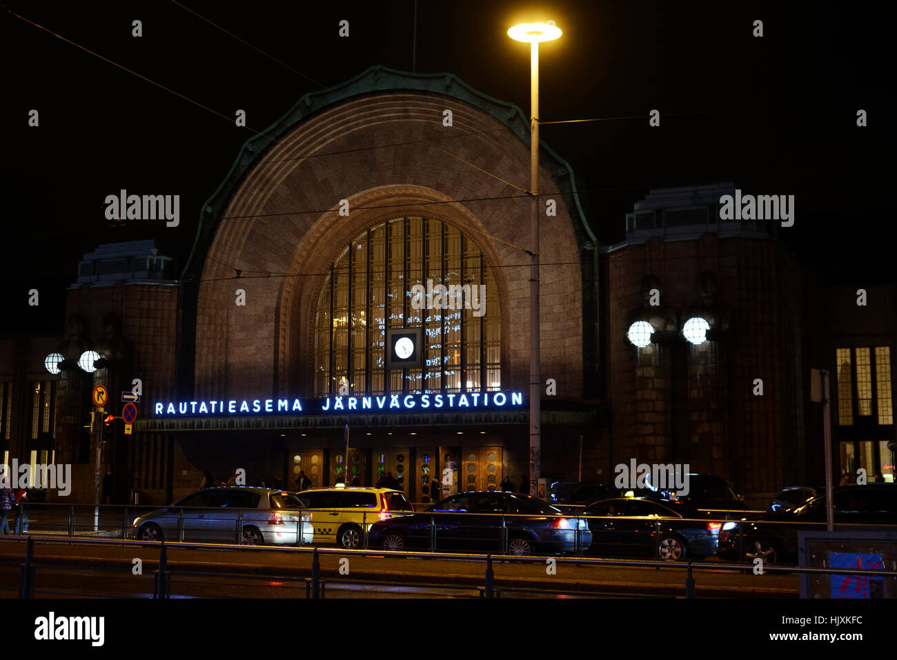 building of railway station in Helsinki at night, Finland Stock Photo