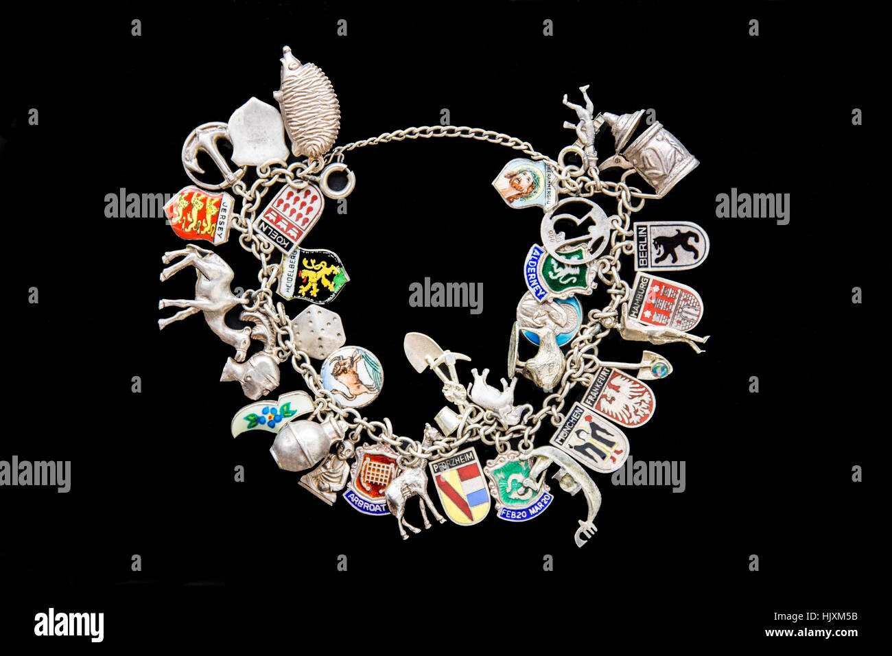 Charm Bracelet with some German Towns and a variety of  trinkets. Stock Photo