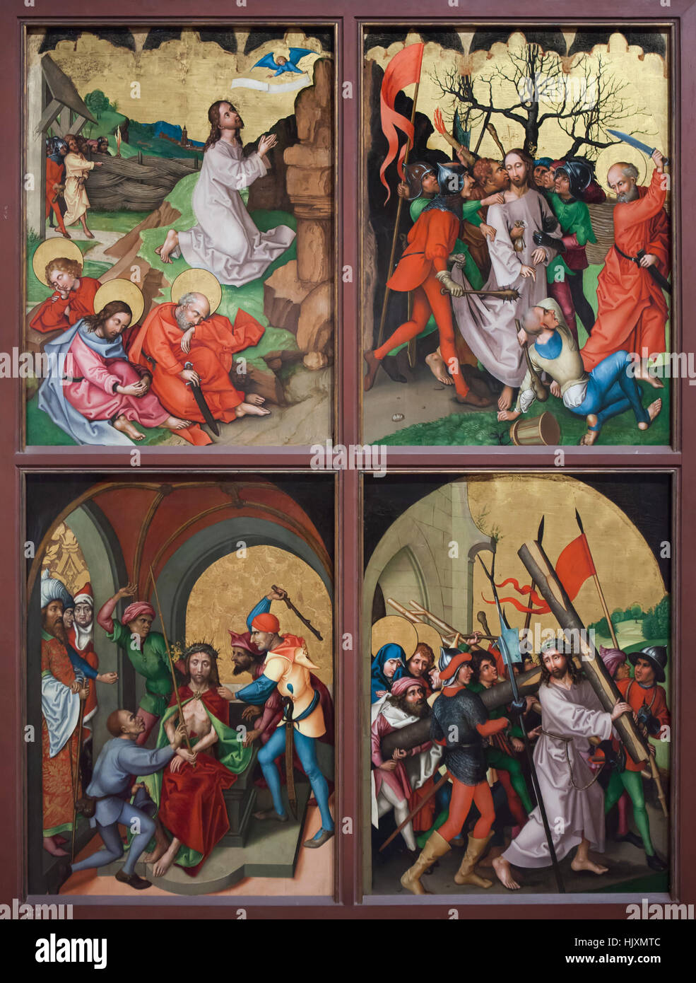 Wing of the altarpiece from circa 1480 by German Renaissance painter Martin Schongauer from the Dominican Church in Colmar on display in the Musee d'Unterlinden (Unterlinden Museum) in Colmar, Alsace, France. Depicted scenes (from left to right from top to bottom): Agony in the Garden, Kiss of Judas Iscariot, Mocking of Christ and Christ carrying the cross. Stock Photo