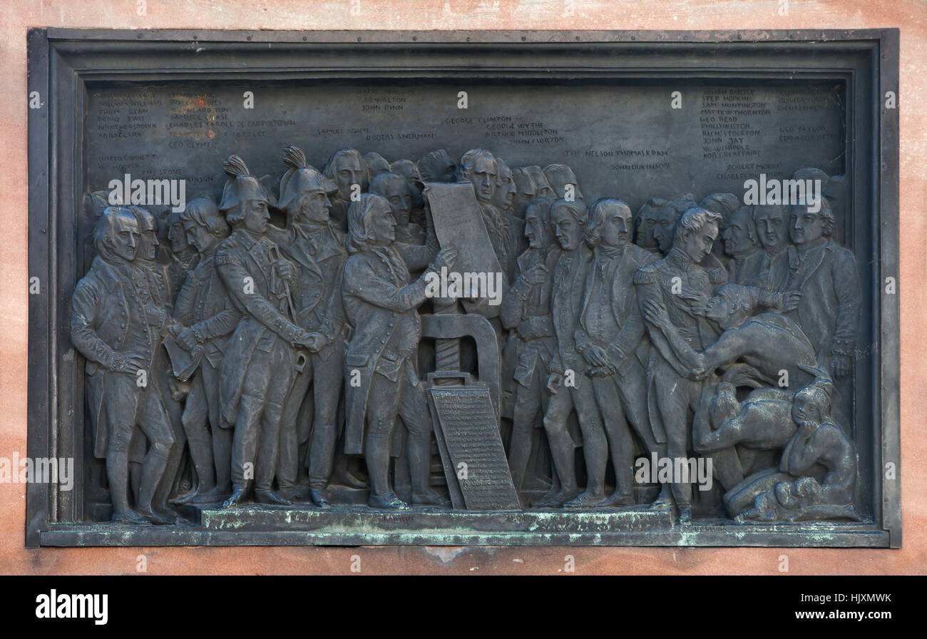 Bronze relief devoted to the benefits of book printing for America on the monument to Johannes Gutenberg (1840) by French sculptor David d'Angers in Strasbourg, Alsace, France. Persons in the foreground from left to right: Benjamin Rush, Lewis Morris and Thomas Jefferson, General Lafayette and George Washington (both in bicornes), Benjamin Franklin holding the Declaration of Independence depicted next to the printing press, John Hancock, Henry Laurens, John Adams and Simon Bolivar with the Indians. George Clinton, Francis Hopkinson, Charles Carroll, George Wythe, John Morton, Samuel Chase, Tho Stock Photo