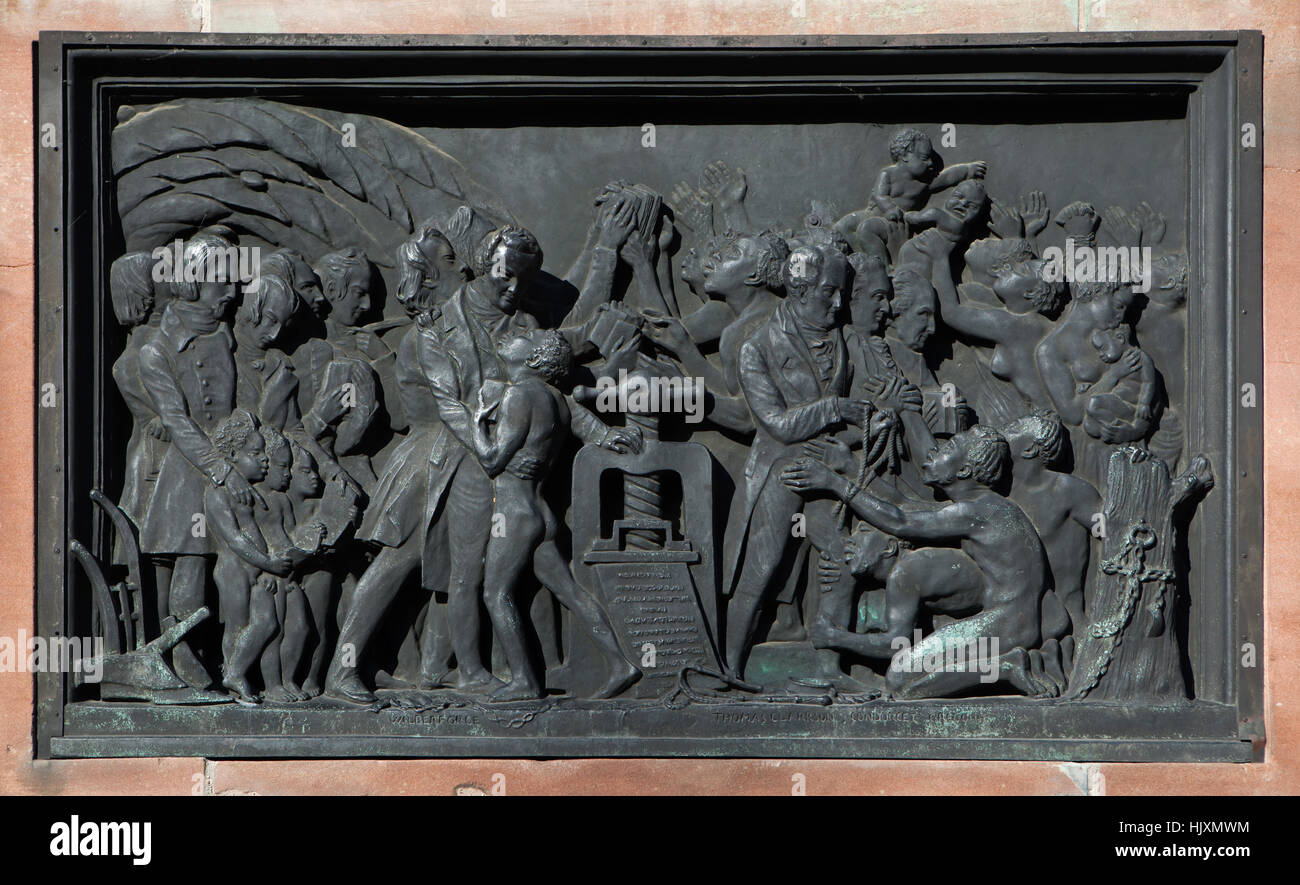 Bronze relief devoted to the benefits of book printing for Africa on the monument to Johannes Gutenberg (1840) by French sculptor David d'Angers in Strasbourg, Alsace, France. English abolitionist William Wilberforce depicted next to the printing press in the centre. English abolitionist Thomas Clarkson, French philosopher Marquis de Condorcet and French Roman Catholic priest Henri Gregoire are depicted in from left to right in the right surrounded by free slaves. Stock Photo